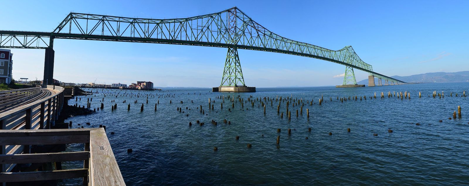 High metal bridge across a large expanse of water